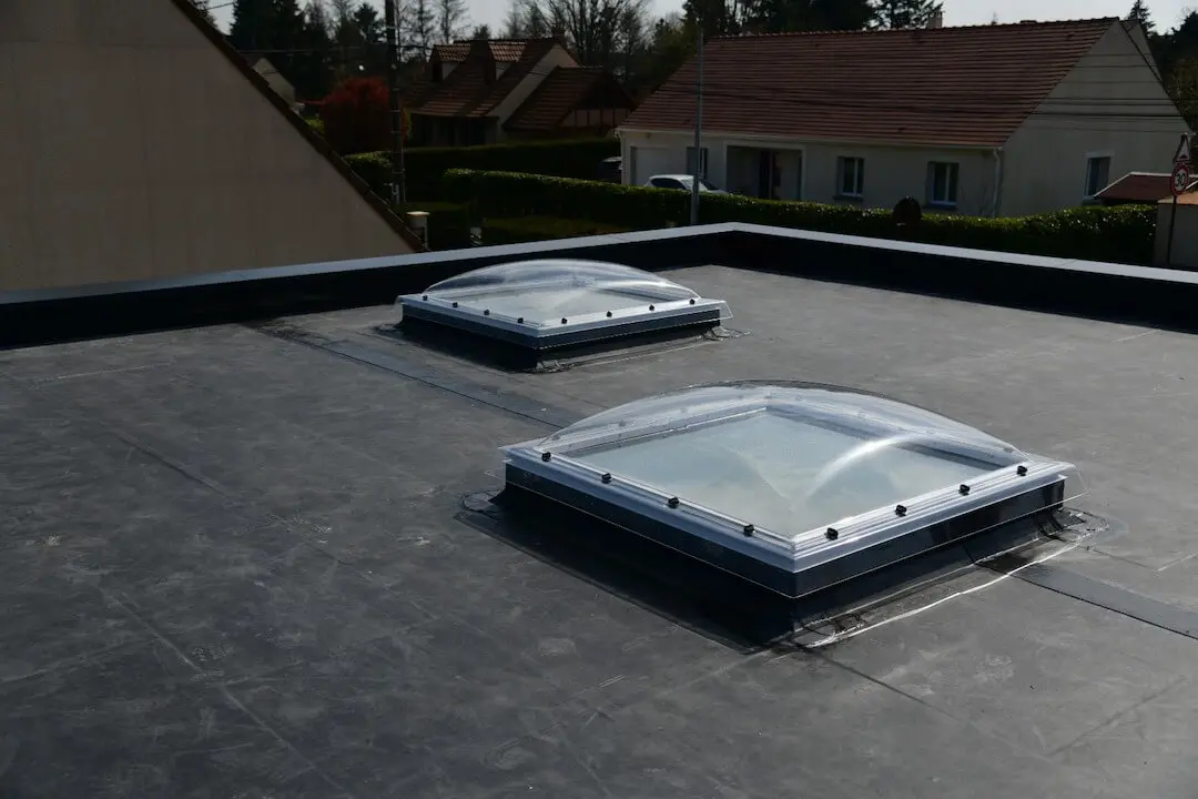 Flat roof on residential building with skylights