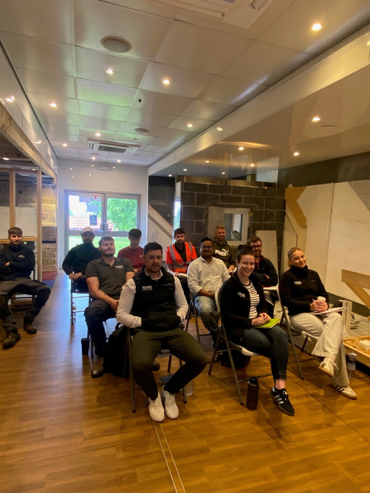 happy employees learning about retrofit standards